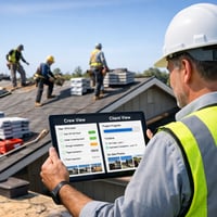 Roofing project manager reviewing a checklist, schedule, and photo updates on a tablet while a roofing crew works safely in the background.